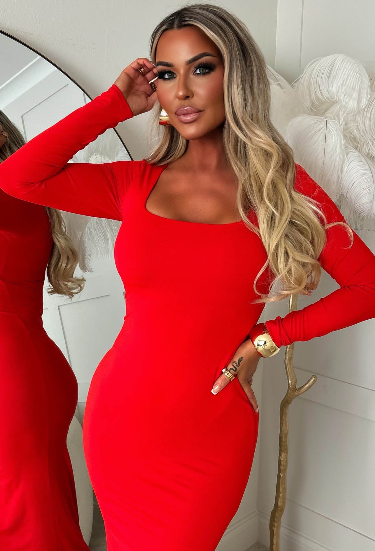 Red square neck long sleeve bodycon dress with a fitted silhouette and midi length.