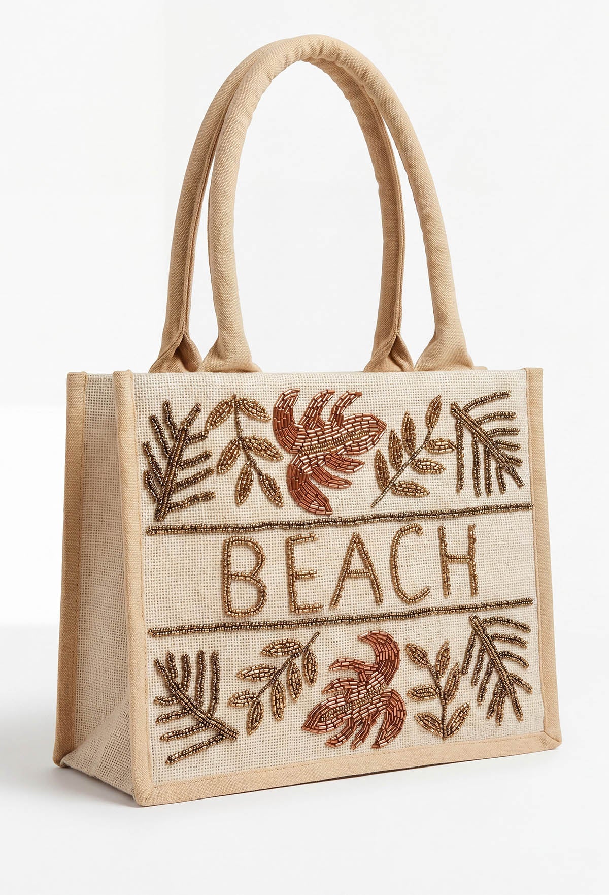 Beige beach beaded bag with sturdy handles, beaded leaf details and BEACH lettering on the front.