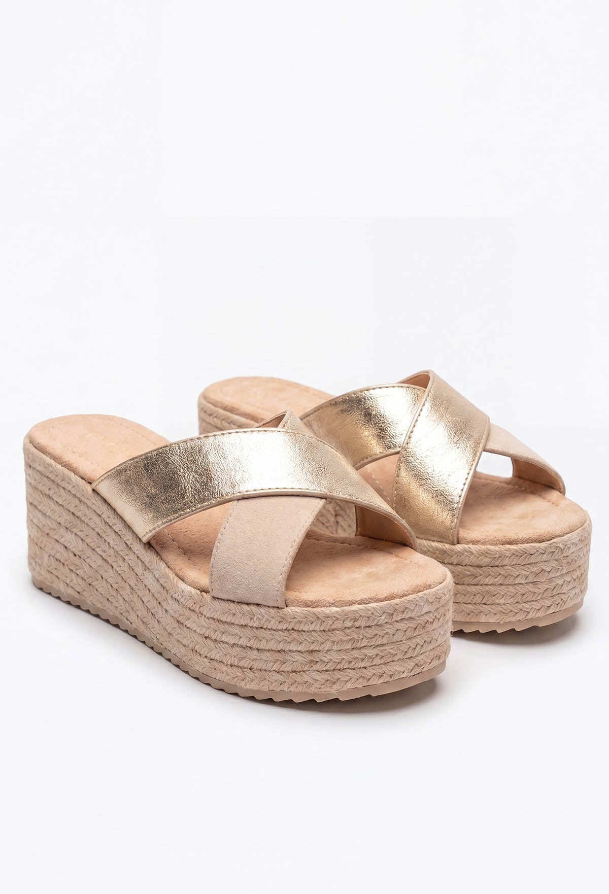 Gold raffia mule wedges with criss-cross metallic straps and a chunky woven platform heel.
