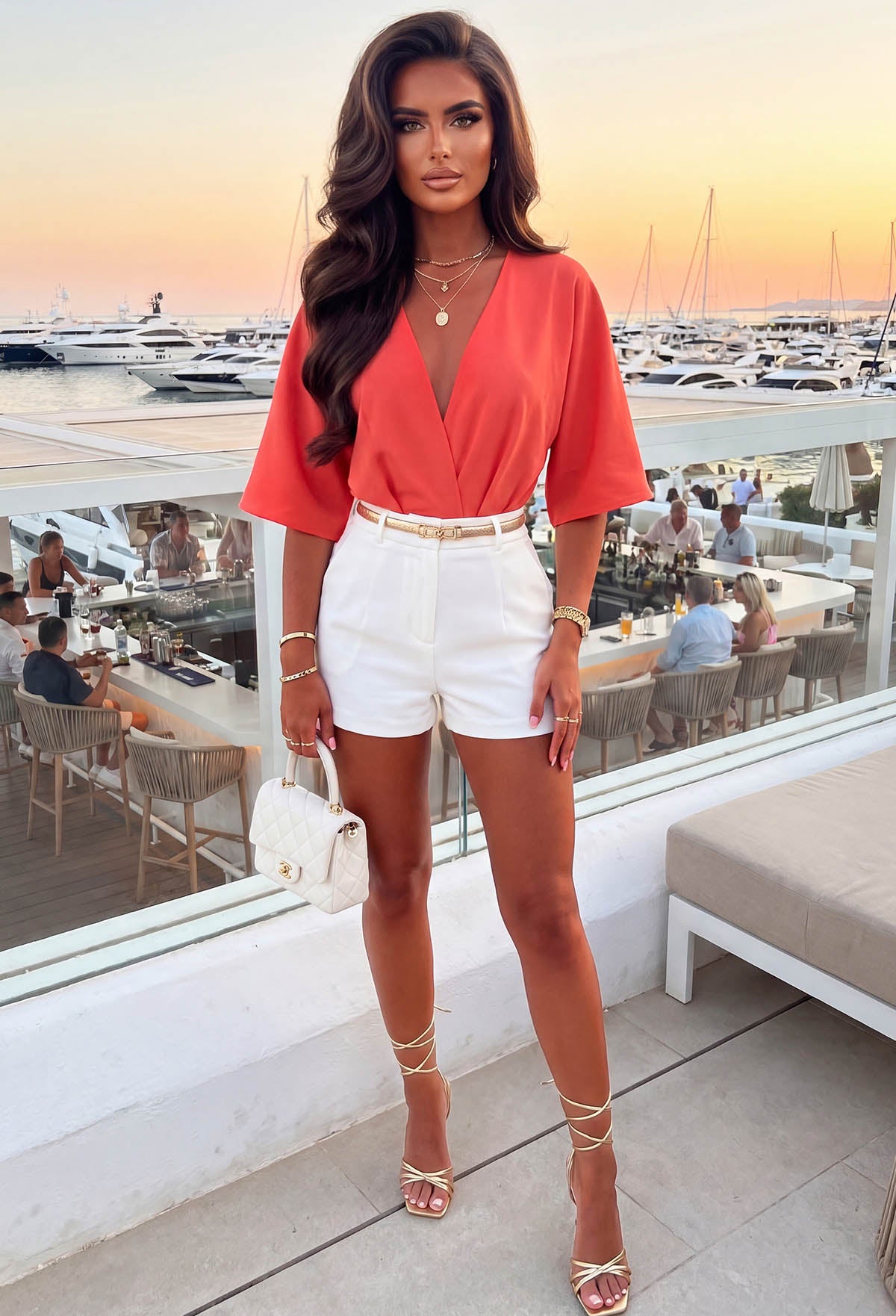 Model on Rooftop Wearing Coral Scuba Crepe Bodysuit