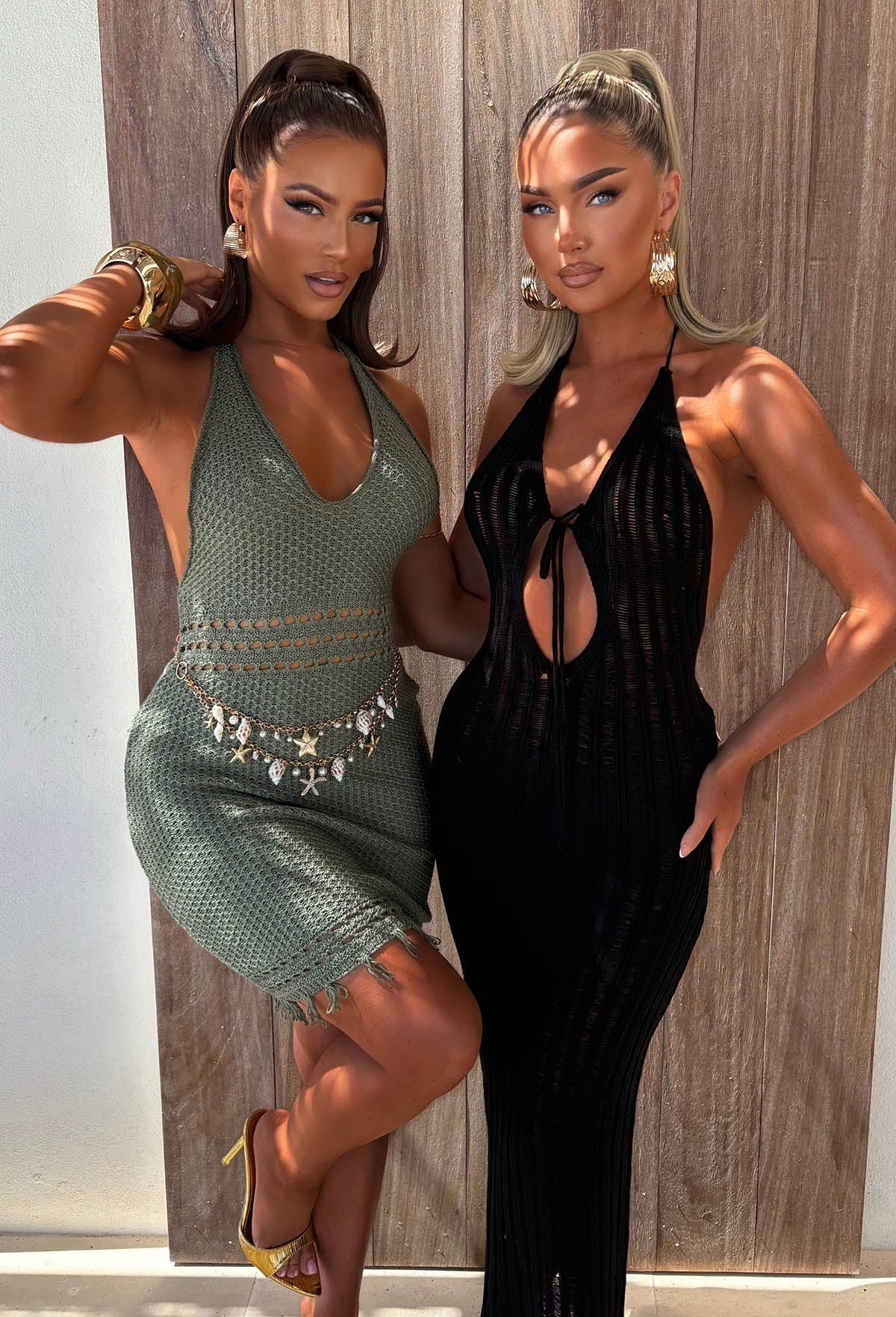 Black knitted maxi cover up with a halterneck, front keyhole cut-out and sheer stretch fabric.