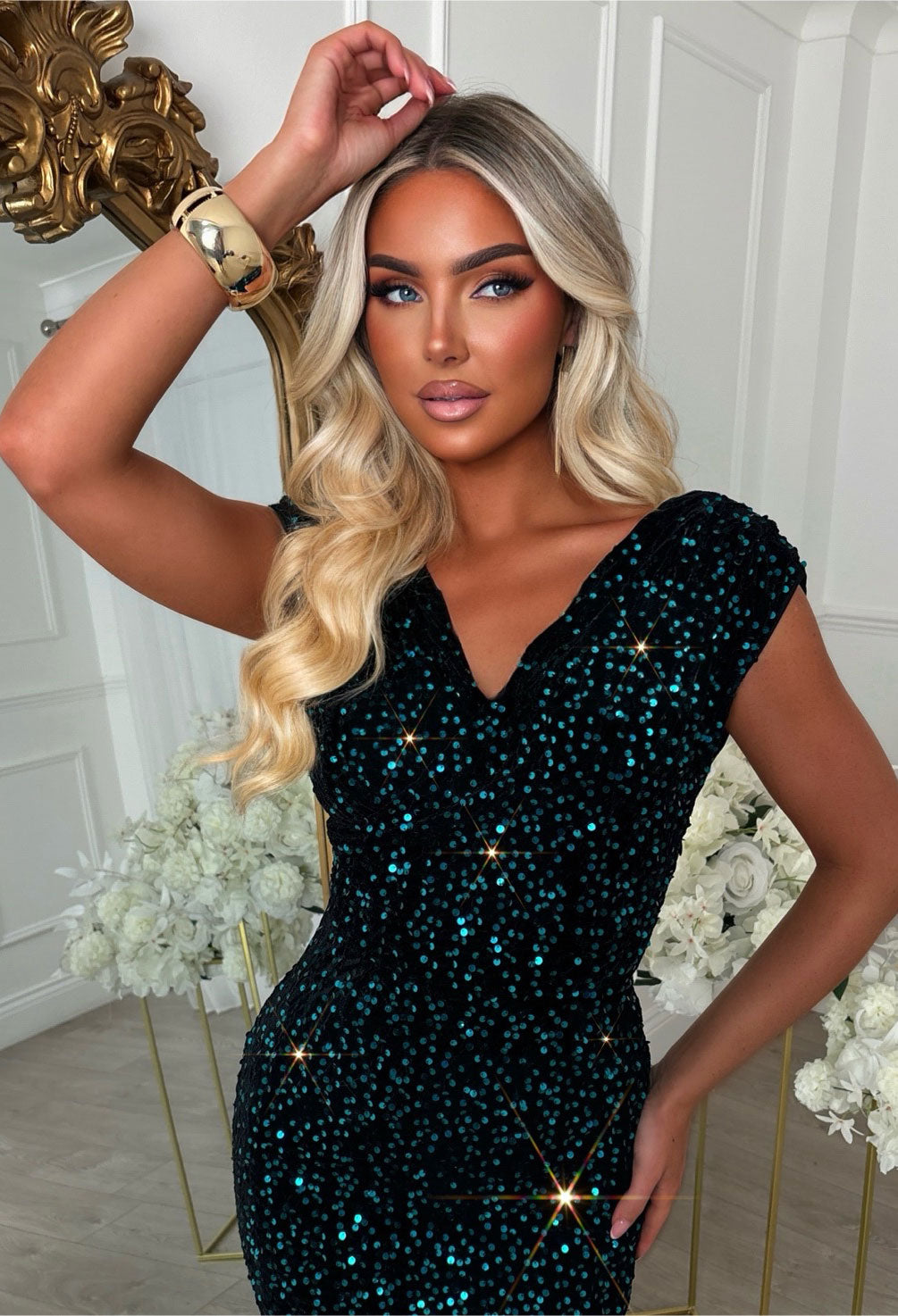 Teal sequin midi dress with a sleeveless design, V-neckline and figure-hugging fit.