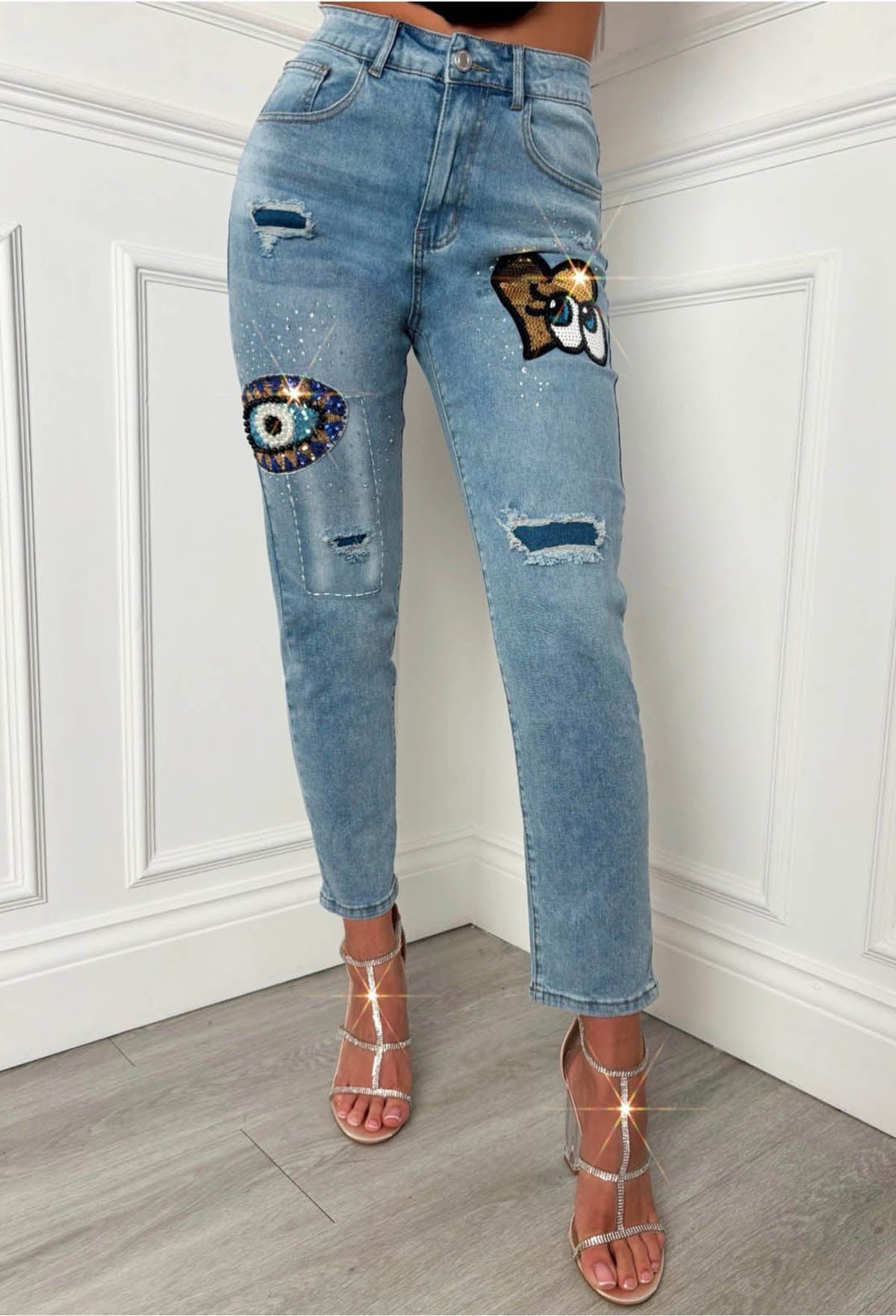 Mid wash denim jeans with slim straight leg fit, distressed details and sequin heart graffiti patches.