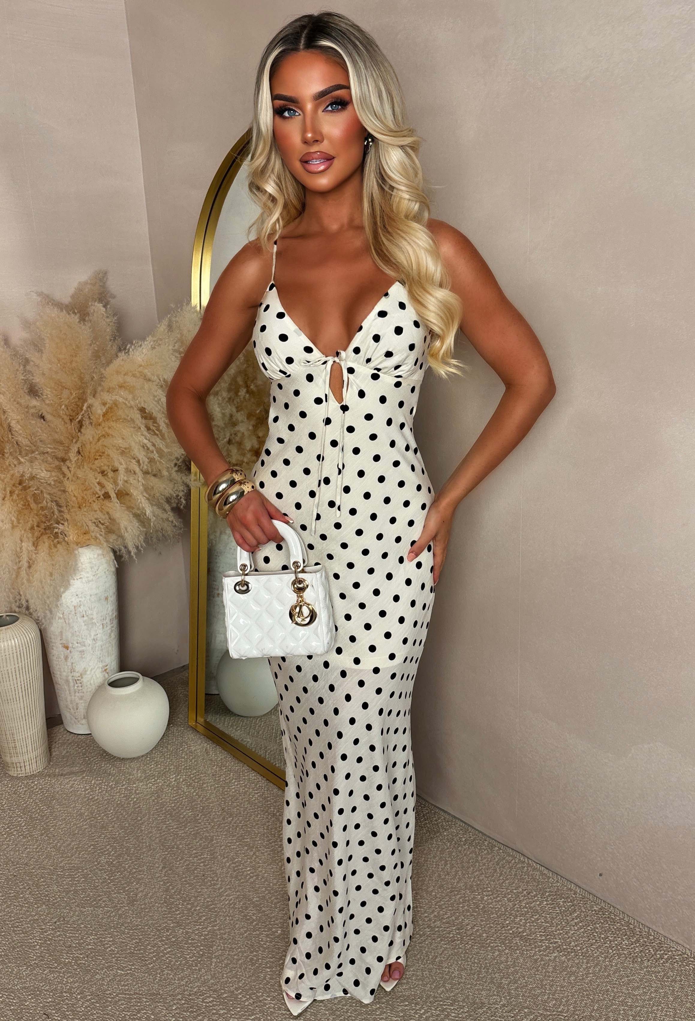 Neutral polka dot cut out back maxi dress with a fitted silhouette and thin straps.