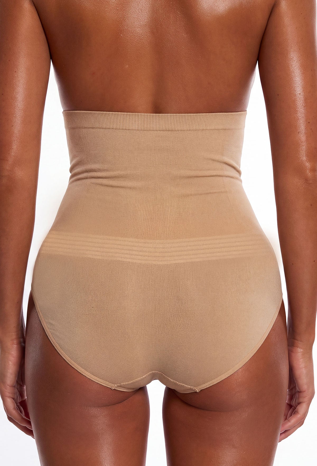 Neutral high-waisted tummy control underwear with a smooth seamless finish and supportive shaping panels.