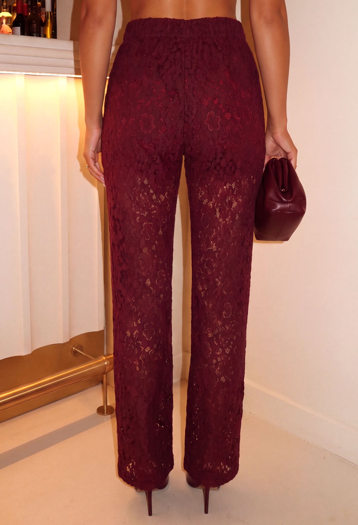 Burgundy lace wide leg trousers with sheer floral lace fabric, high waist and full-length hem.