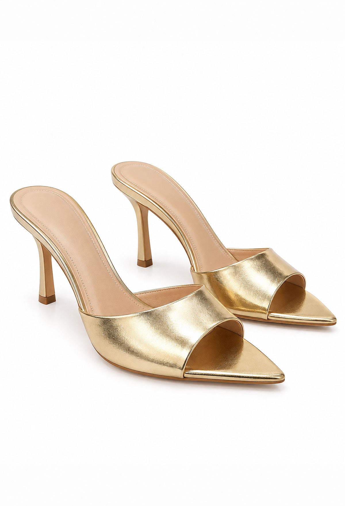 Gold stiletto pointed mule heel with open back, high heel and metallic finish styled with a mini dress.