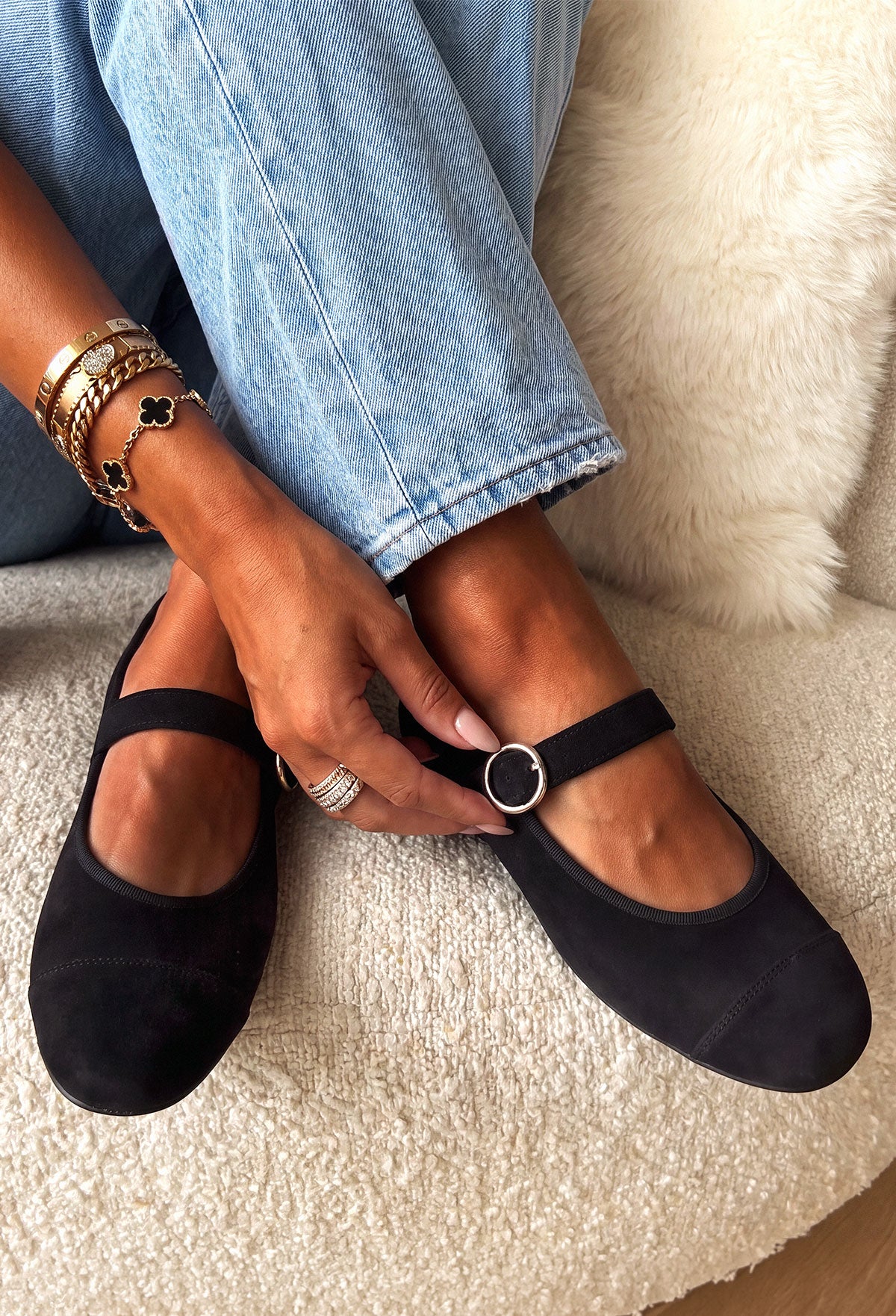 Black Mary Jane flat shoe in smooth matte black with a rounded toe and single strap fastening.
