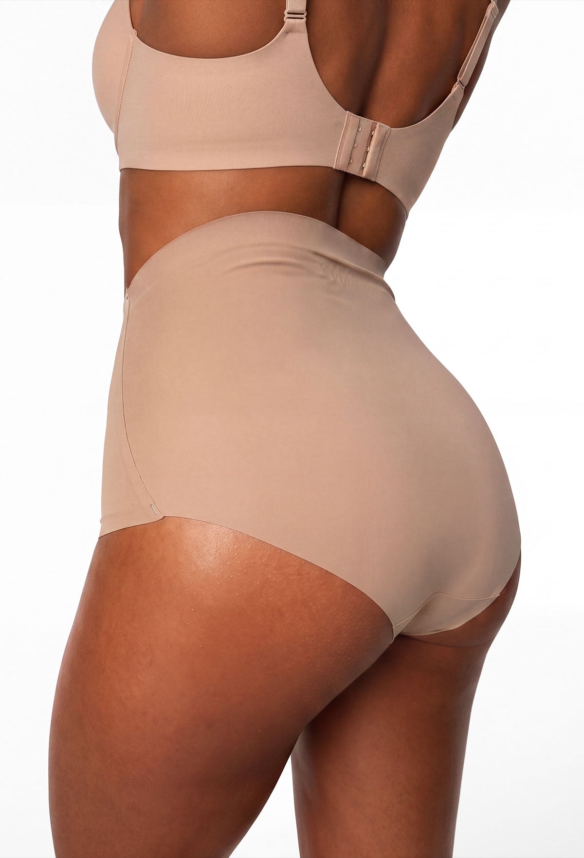 Flat lay of neutral seamless brief underwear with a high waist and smooth finish, shown with other colours.