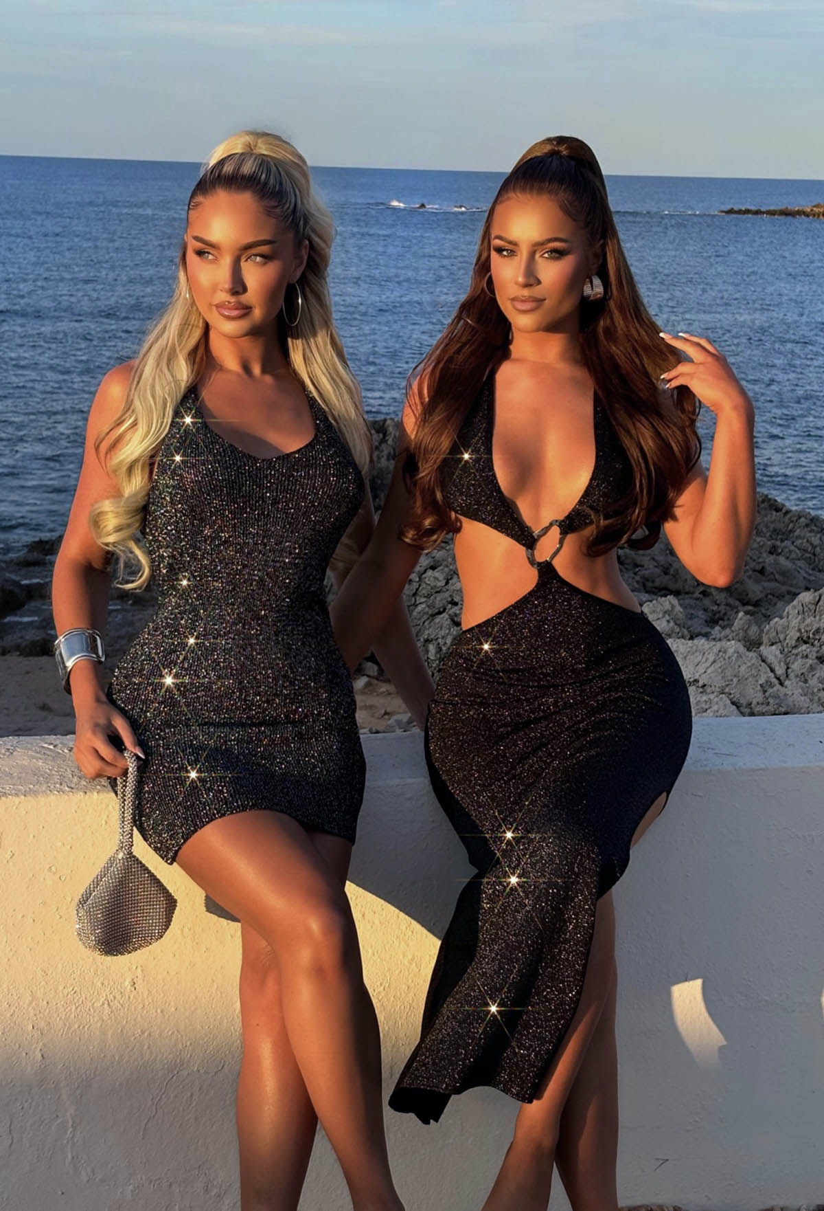 Model Duo By Sea Sat Wearing Black Knitted Halter Neck Lurex Mini Dress Close Up Front View