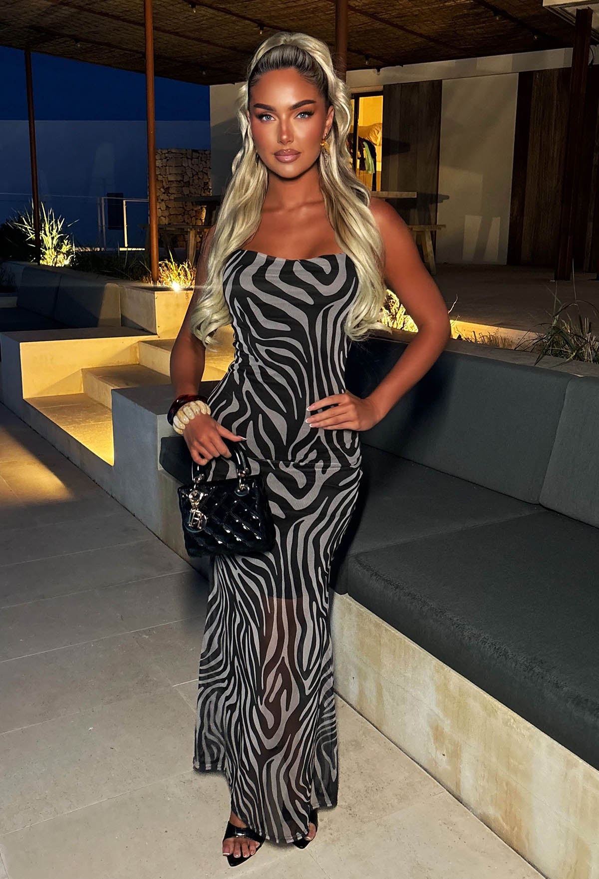 Model In Holiday Villa Wearing Black Zebra Print Mesh Maxi Dress Full Length Front View