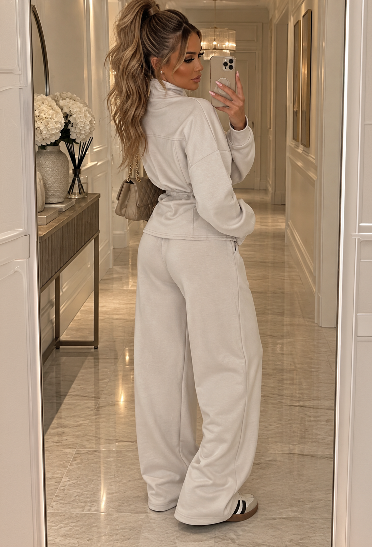 Cream drawstring waist co-ord set featuring a zip-up long sleeve top and wide leg trousers.
