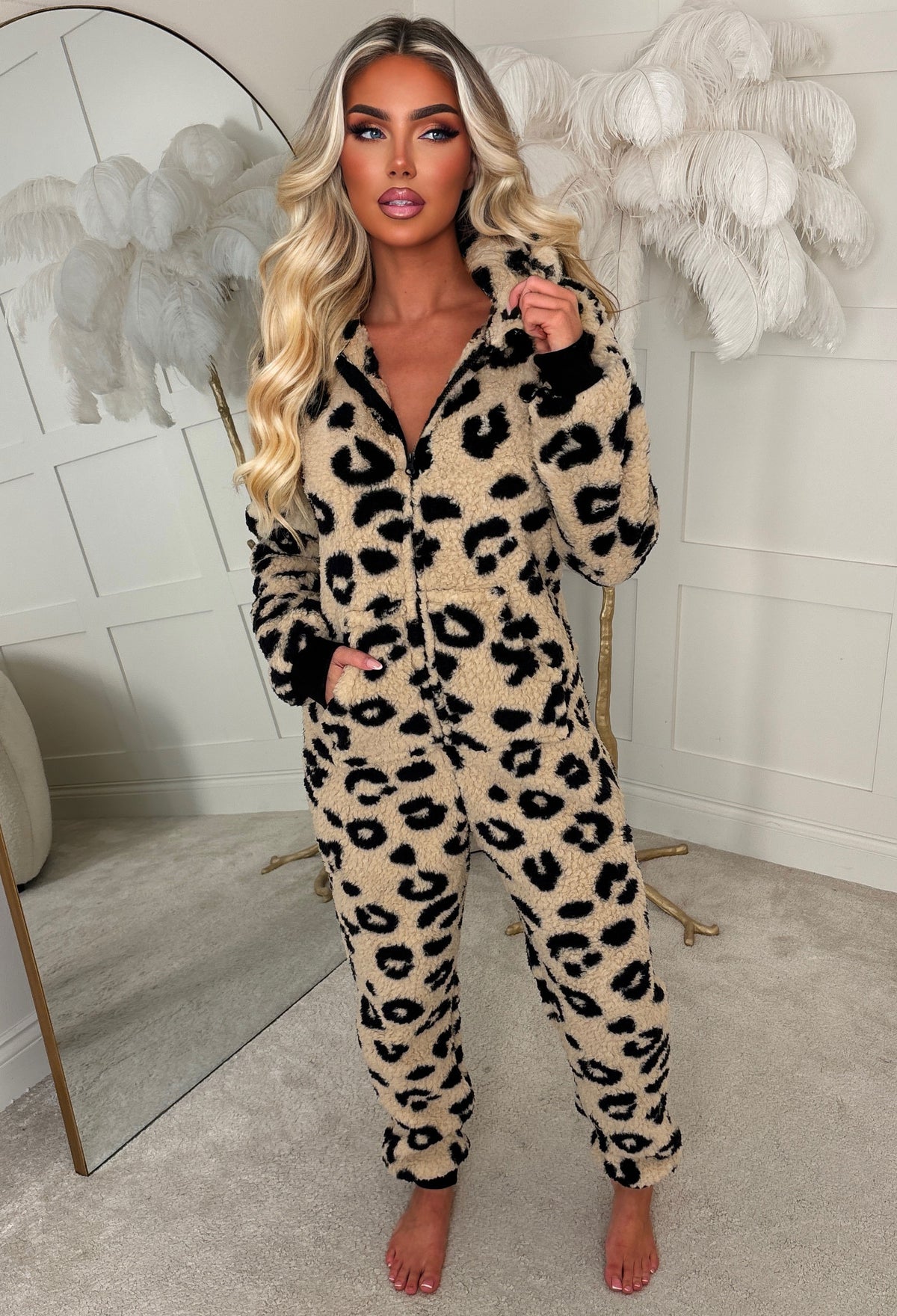Beige leopard print fluffy onesie with a hood, long sleeves and front zip fastening in soft textured fabric.