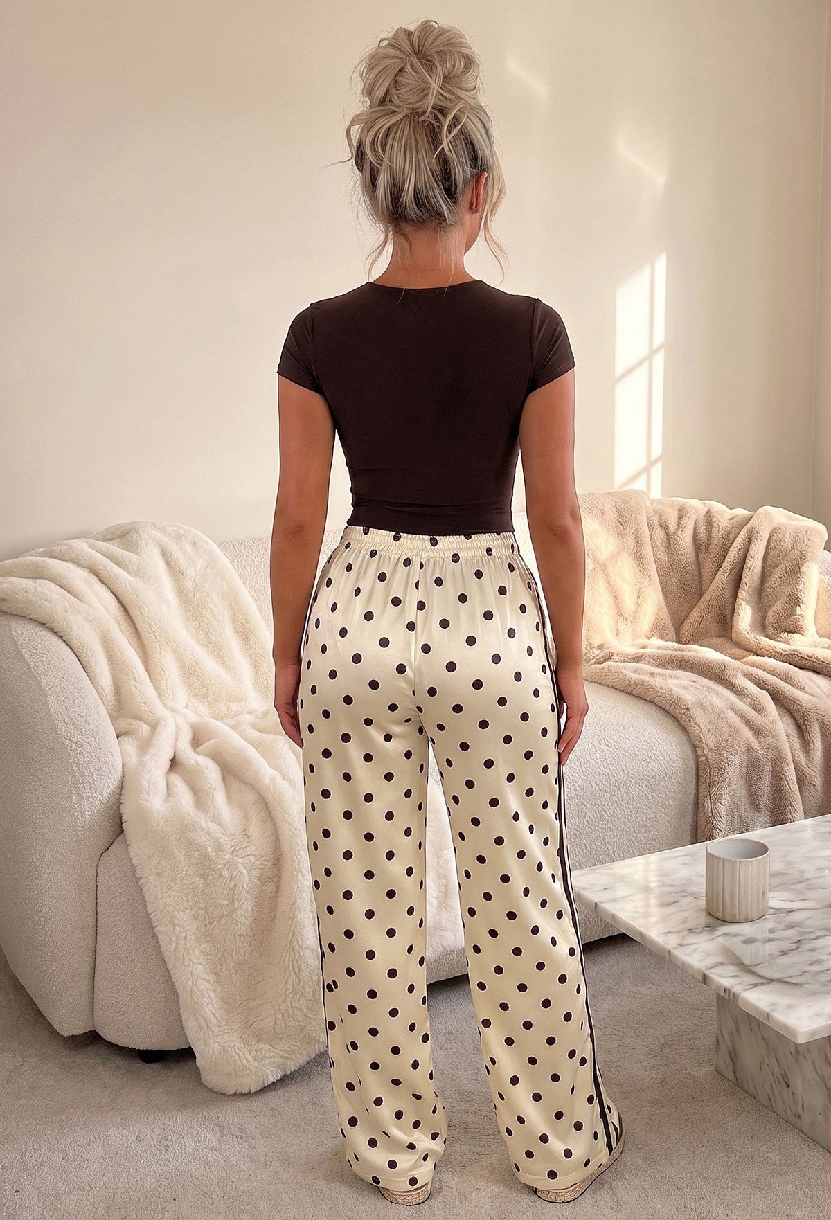 Yellow satin polka dot trousers with brown spots, side stripe detail and relaxed wide leg fit.