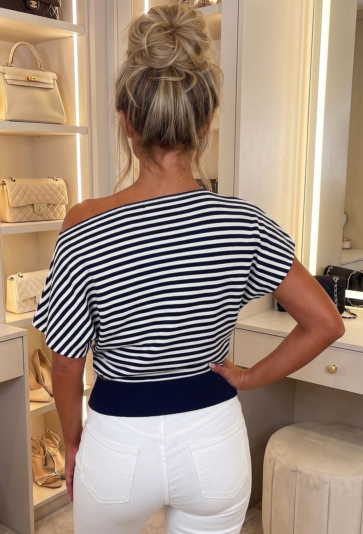 Navy stripe off the shoulder knit top with short sleeves and a fitted ribbed hem.