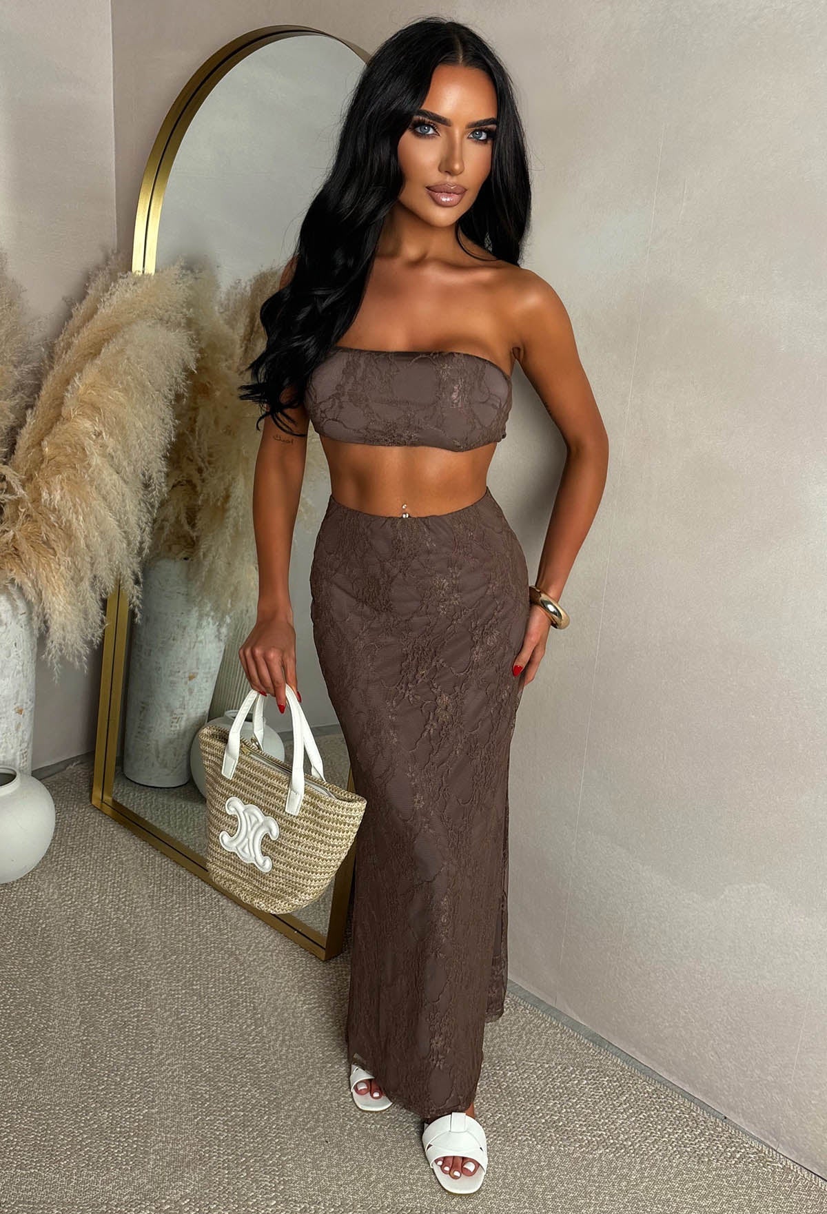 Model In Brown Lace Bandeau Top & Maxi Skirt Co-Ord Set At Beach Club