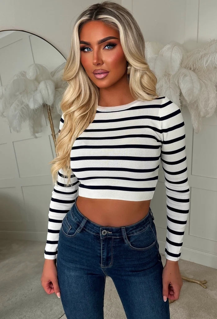 Cream stripe cropped ribbed knit top with long sleeves and a round neckline, featuring a cropped fit.