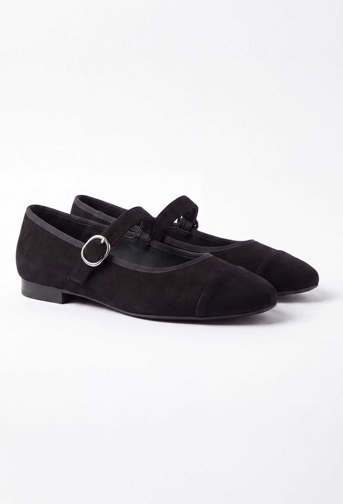 Black Mary Jane flat shoe in smooth matte black with a rounded toe and single strap fastening.