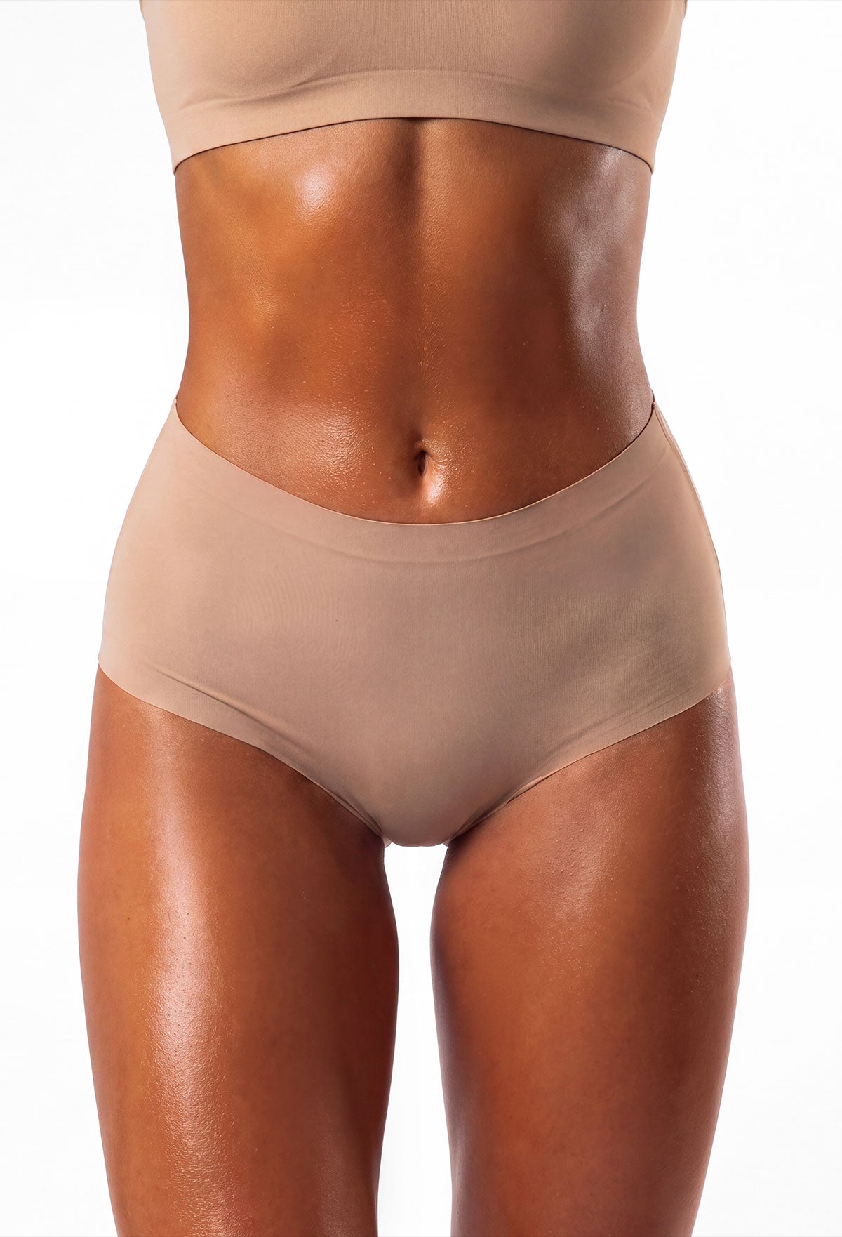 Flat lay of neutral seamless brief underwear with a high waist and smooth finish, shown with other colours.