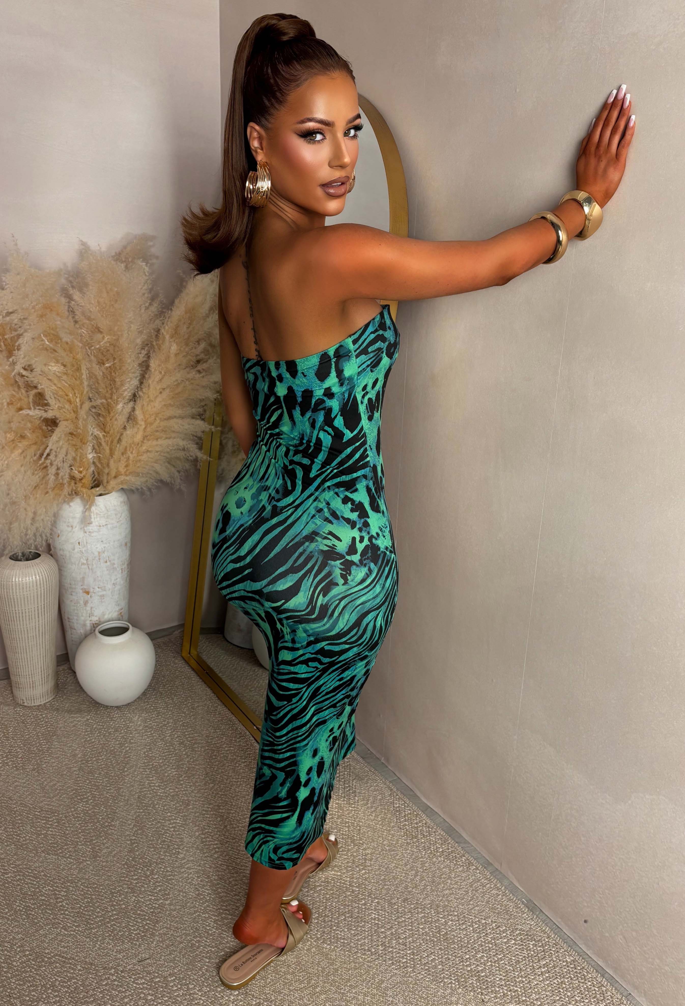 back shot full length Green printed jersey bandeau top with a fitted silhouette, soft stretch fabric, and a side slit detail for a modern, flattering look.