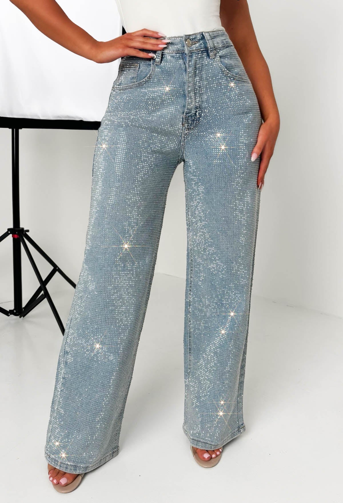 Mid wash straight leg stretch diamante jeans with all-over sparkling embellishments and classic five-pocket design.