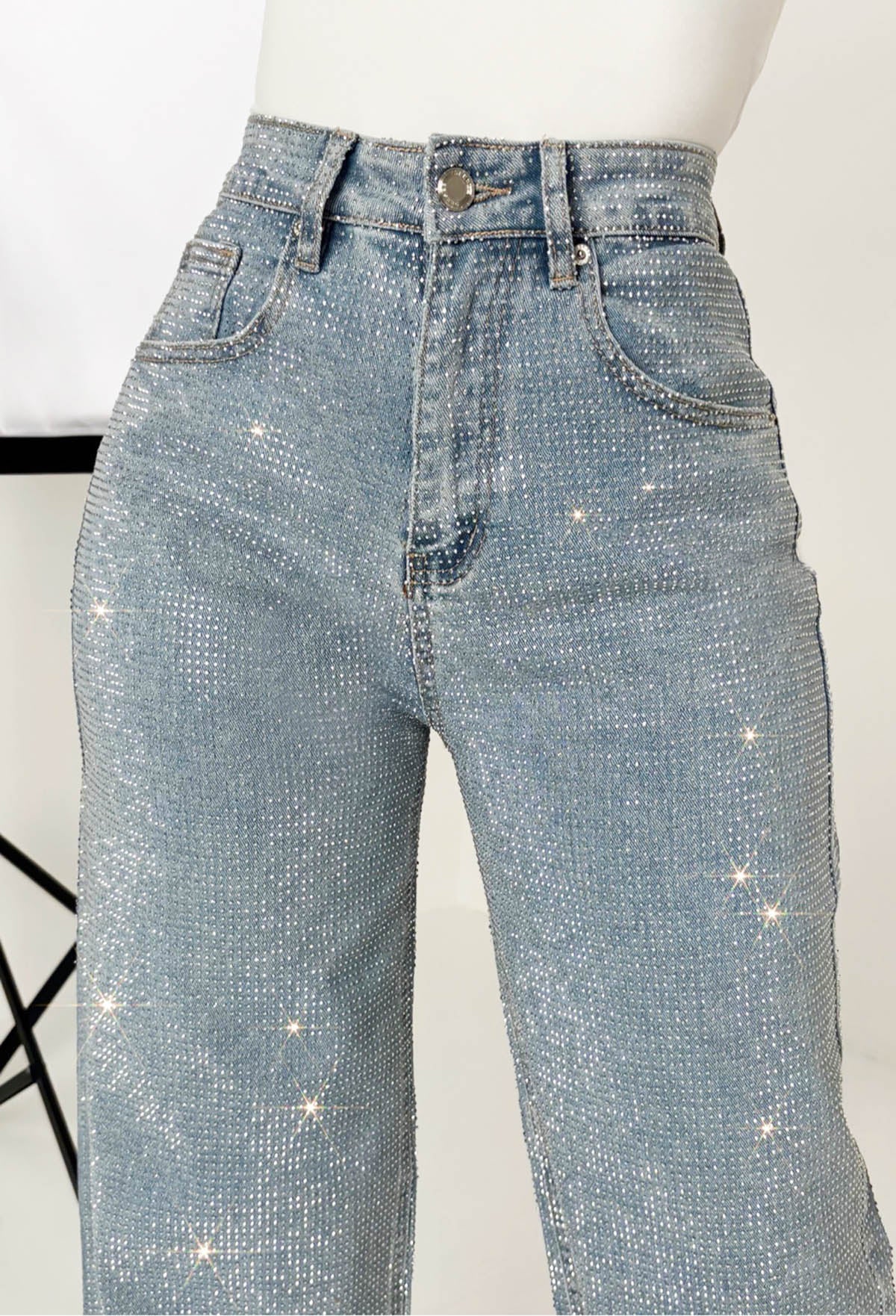 Mid wash straight leg stretch diamante jeans with all-over sparkling embellishments and classic five-pocket design.
