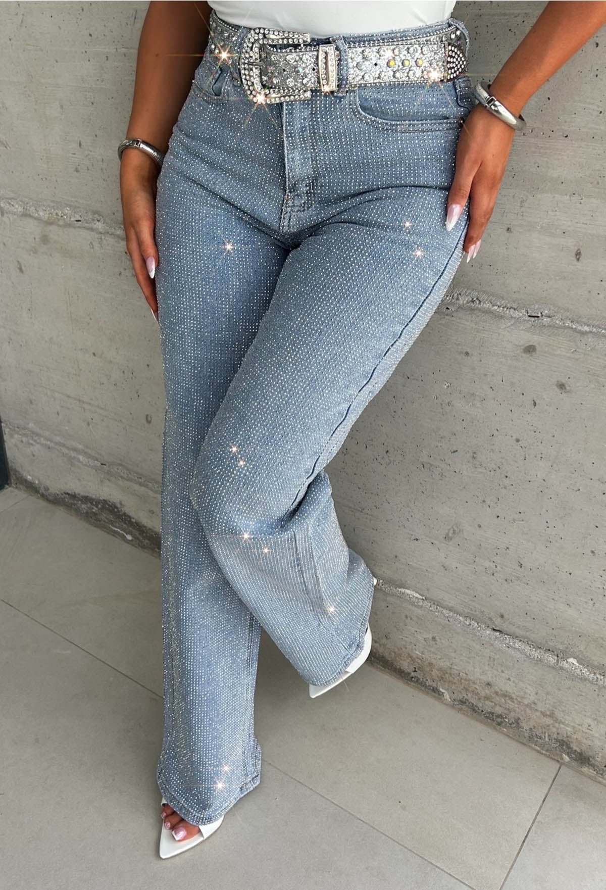 Mid wash straight leg stretch diamante jeans with all-over sparkling embellishments and classic five-pocket design.